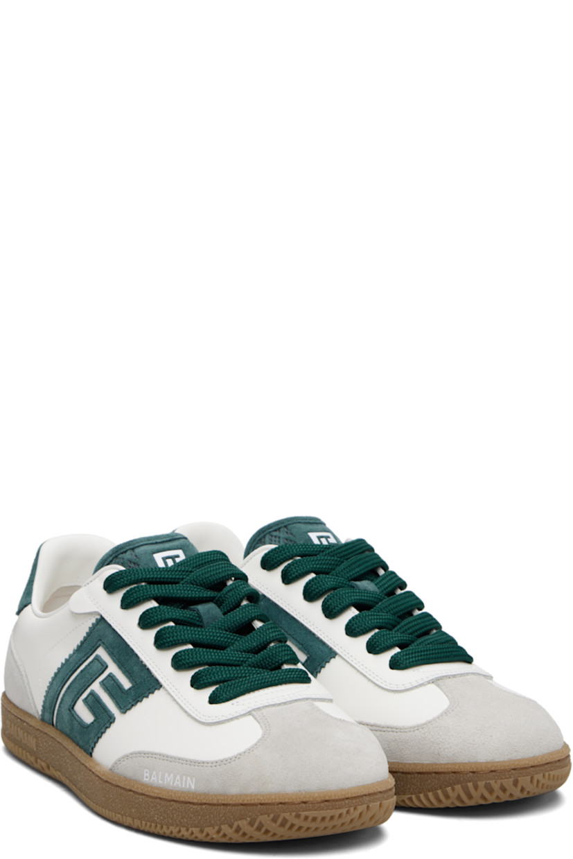 Low-top calfskin suede and buffed calfskin sneakers.

· Serrated edges throughout
· Lace-up closure
· Logo embossed at padded tongue
· Padded collar
· Logo patch at sides
· Logo stamp at outer side and heel tab
· Buffed leather lining
· Treaded rubber sole

Supplier color: White