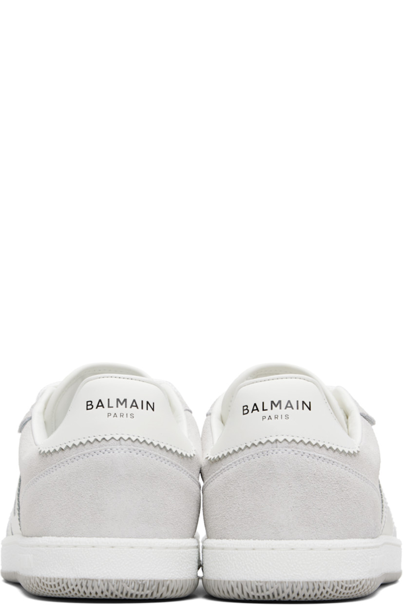 Low-top calfskin suede and cotton canvas sneakers.

· Serrated edges throughout
· Lace-up closure
· Logo embossed at padded tongue
· Padded collar
· Logo patch at sides
· Logo stamp at outer side and heel tab
· Buffed leather lining
· Treaded rubber sole

Supplier color: White