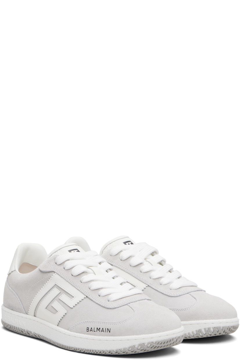 Low-top calfskin suede and cotton canvas sneakers.

· Serrated edges throughout
· Lace-up closure
· Logo embossed at padded tongue
· Padded collar
· Logo patch at sides
· Logo stamp at outer side and heel tab
· Buffed leather lining
· Treaded rubber sole

Supplier color: White