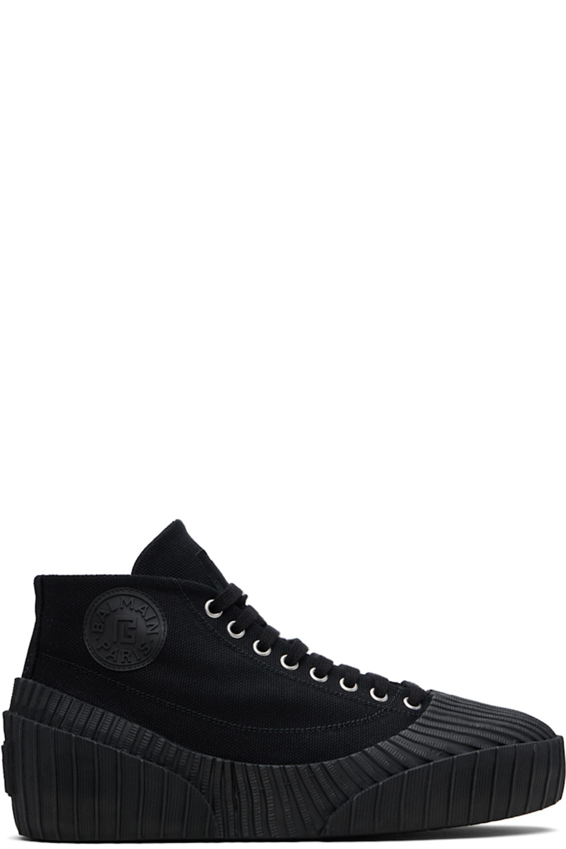 High-top cotton canvas and rubber sneakers.

· Rubber cap toe
· Lace-up closure
· Logo embroidered at tongue
· Rubberized logo patch at outer side and heel
· Canvas lining
· Treaded vulcanized rubber sole

Supplier color: Black