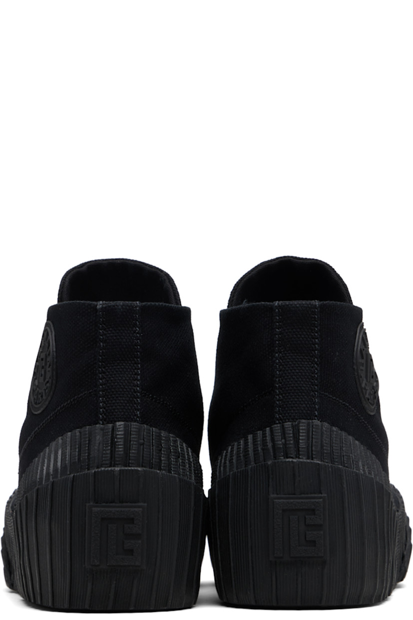 High-top cotton canvas and rubber sneakers.

· Rubber cap toe
· Lace-up closure
· Logo embroidered at tongue
· Rubberized logo patch at outer side and heel
· Canvas lining
· Treaded vulcanized rubber sole

Supplier color: Black
