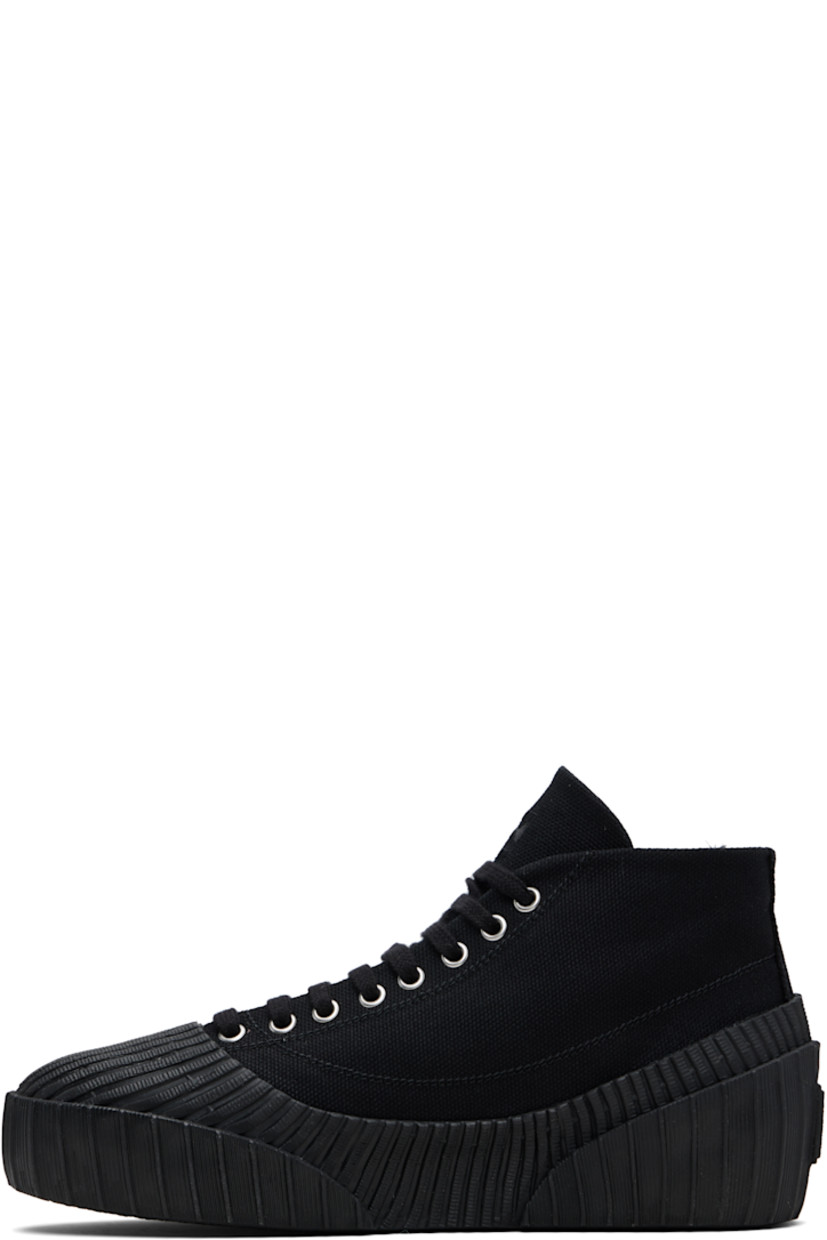 High-top cotton canvas and rubber sneakers.

· Rubber cap toe
· Lace-up closure
· Logo embroidered at tongue
· Rubberized logo patch at outer side and heel
· Canvas lining
· Treaded vulcanized rubber sole

Supplier color: Black