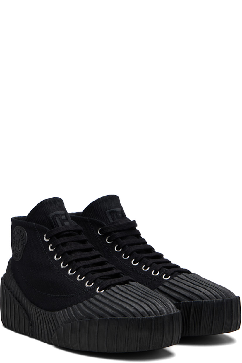 High-top cotton canvas and rubber sneakers.

· Rubber cap toe
· Lace-up closure
· Logo embroidered at tongue
· Rubberized logo patch at outer side and heel
· Canvas lining
· Treaded vulcanized rubber sole

Supplier color: Black