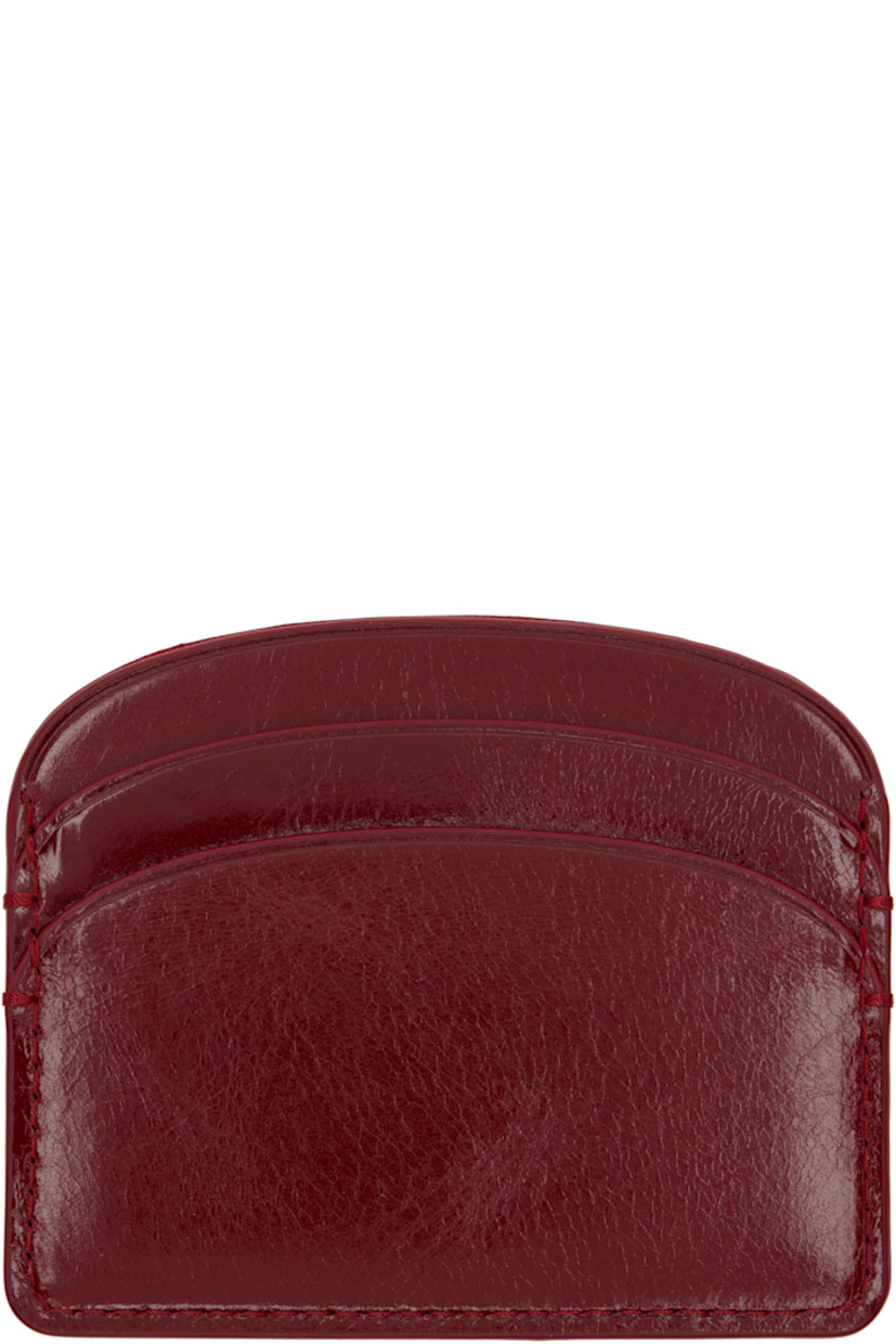 Crackled patent leather card holder. 

· Gold-tone logo stamp at face
· Four card slots 
· Central note slot 
· Twill lining
· H3.25" x W4"

Supplier color: Red