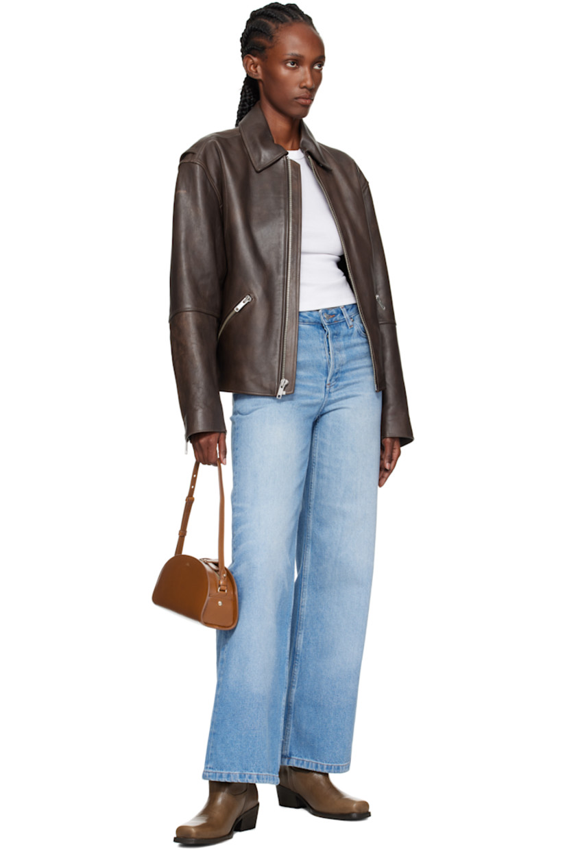 Crackled patent calfskin shoulder bag.

· Adjustable and detachable shoulder strap
· Gold-tone logo stamp at face
· Two-way zip closure
· Patch pocket at interior
· Cotton twill lining
· Gold-tone hardware
· H5.5" x W10.5" x D3.5"

Supplier color: Coffee