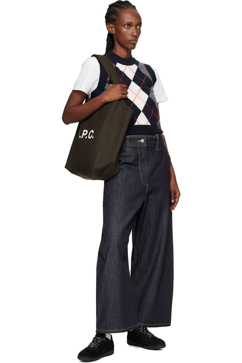 Wool-blend melton tote.

· Twin shoulder straps
· Logo printed at face
· Patch pocket at interior
· Twill lining
· H14.5" x W19.5" x D6.25"

Supplier color: Kaki chine