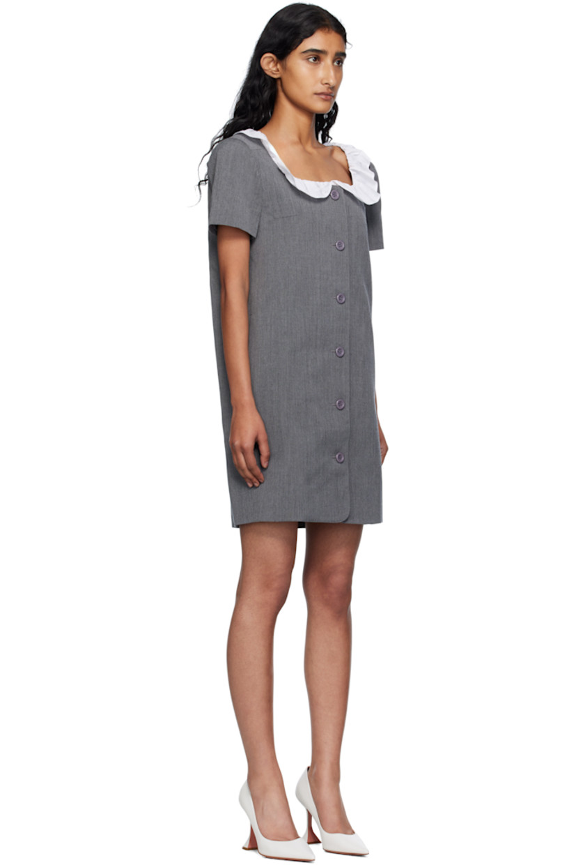 Wool canvas minidress.

· Ruffled trim at scoop neck
· Button closure
· Welt pocket and darts at chest
· Seam pockets
· Full satin lining

Supplier color: Grey