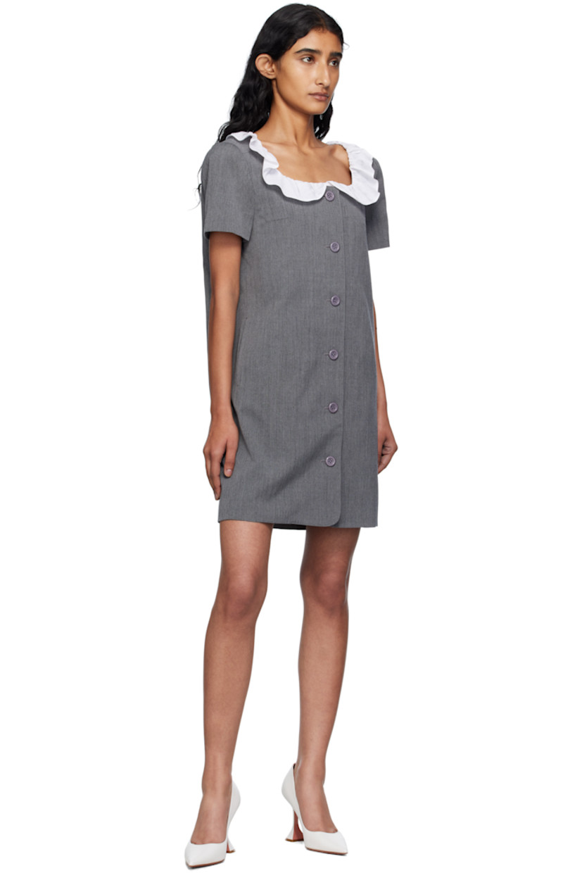 Wool canvas minidress.

· Ruffled trim at scoop neck
· Button closure
· Welt pocket and darts at chest
· Seam pockets
· Full satin lining

Supplier color: Grey