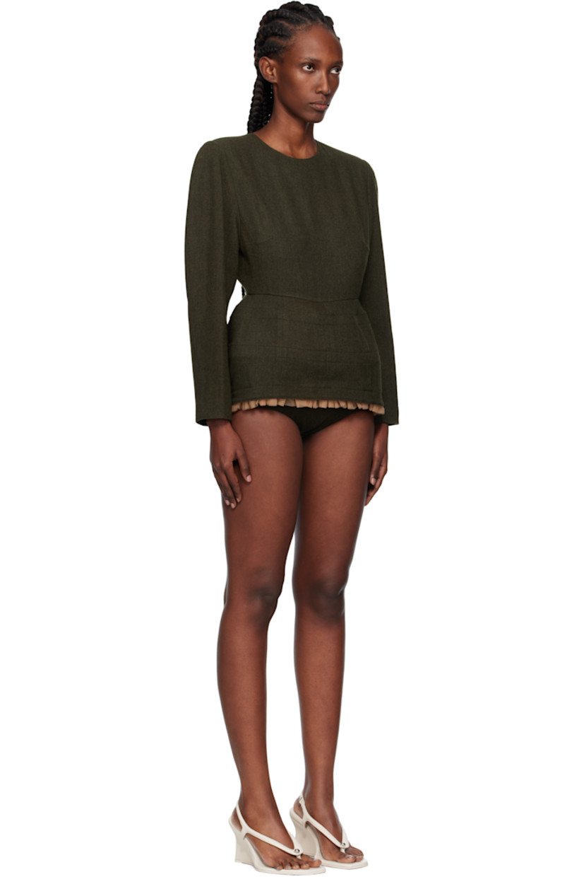 Wool-blend flannel minidress.

· Round neck
· Ruffled tulle trim and integrated briefs-style trim at hem
· Seam pockets
· Padded shoulders
· Zip closure and button closure at back
· Full satin lining

Supplier color: Kh