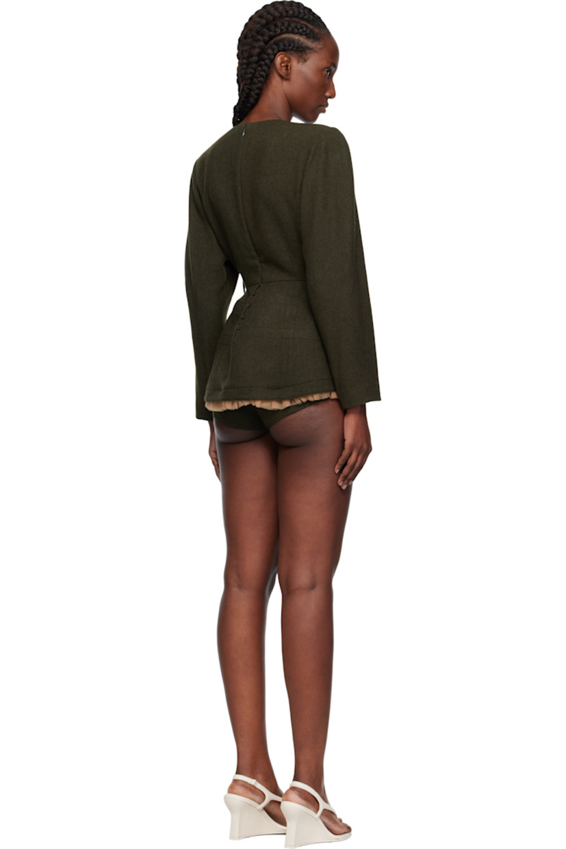 Wool-blend flannel minidress.

· Round neck
· Ruffled tulle trim and integrated briefs-style trim at hem
· Seam pockets
· Padded shoulders
· Zip closure and button closure at back
· Full satin lining

Supplier color: Kh