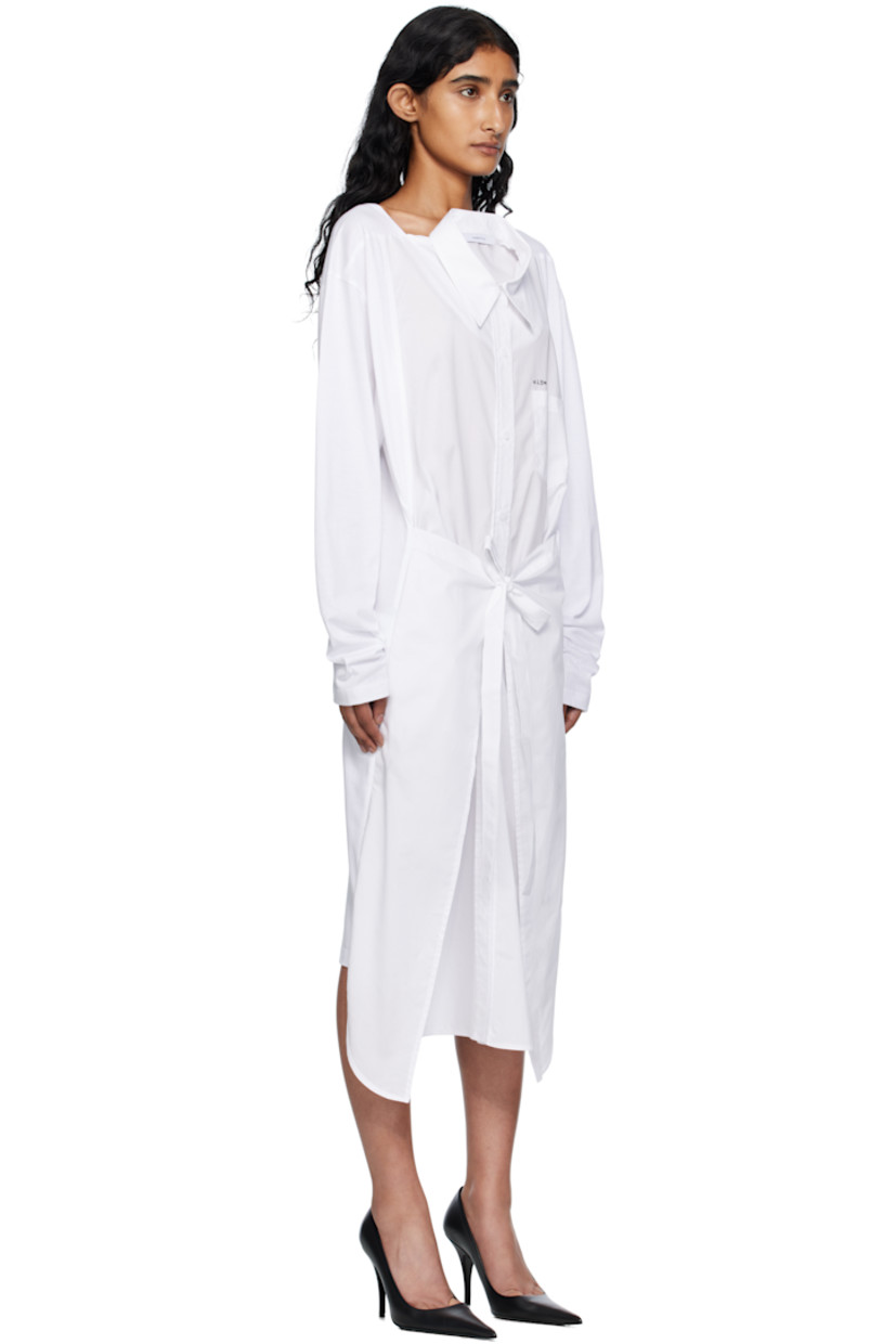 Cotton poplin and jersey midi dress.

· Paneled construction
· Square neck
· Spread collar for alternate styling
· Button closure
· Printed text and patch pocket at chest
· Self-tie fastening at waist
· Seam pockets
· Shirttail hem
· Dropped shoulders

Supplier color: White