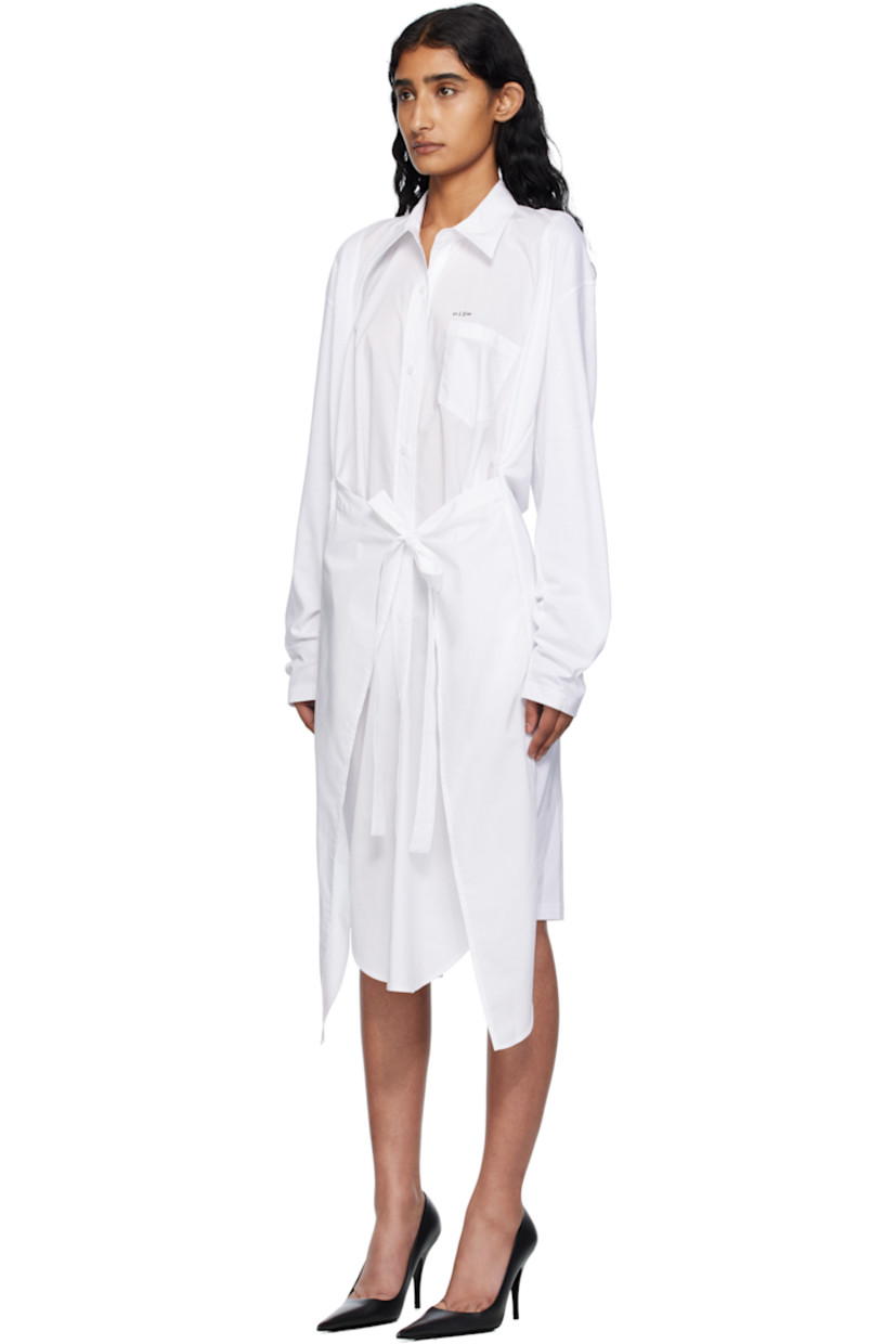 Cotton poplin and jersey midi dress.

· Paneled construction
· Square neck
· Spread collar for alternate styling
· Button closure
· Printed text and patch pocket at chest
· Self-tie fastening at waist
· Seam pockets
· Shirttail hem
· Dropped shoulders

Supplier color: White