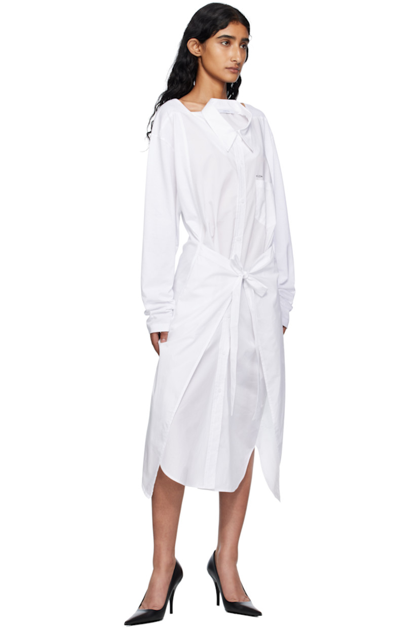 Cotton poplin and jersey midi dress.

· Paneled construction
· Square neck
· Spread collar for alternate styling
· Button closure
· Printed text and patch pocket at chest
· Self-tie fastening at waist
· Seam pockets
· Shirttail hem
· Dropped shoulders

Supplier color: White