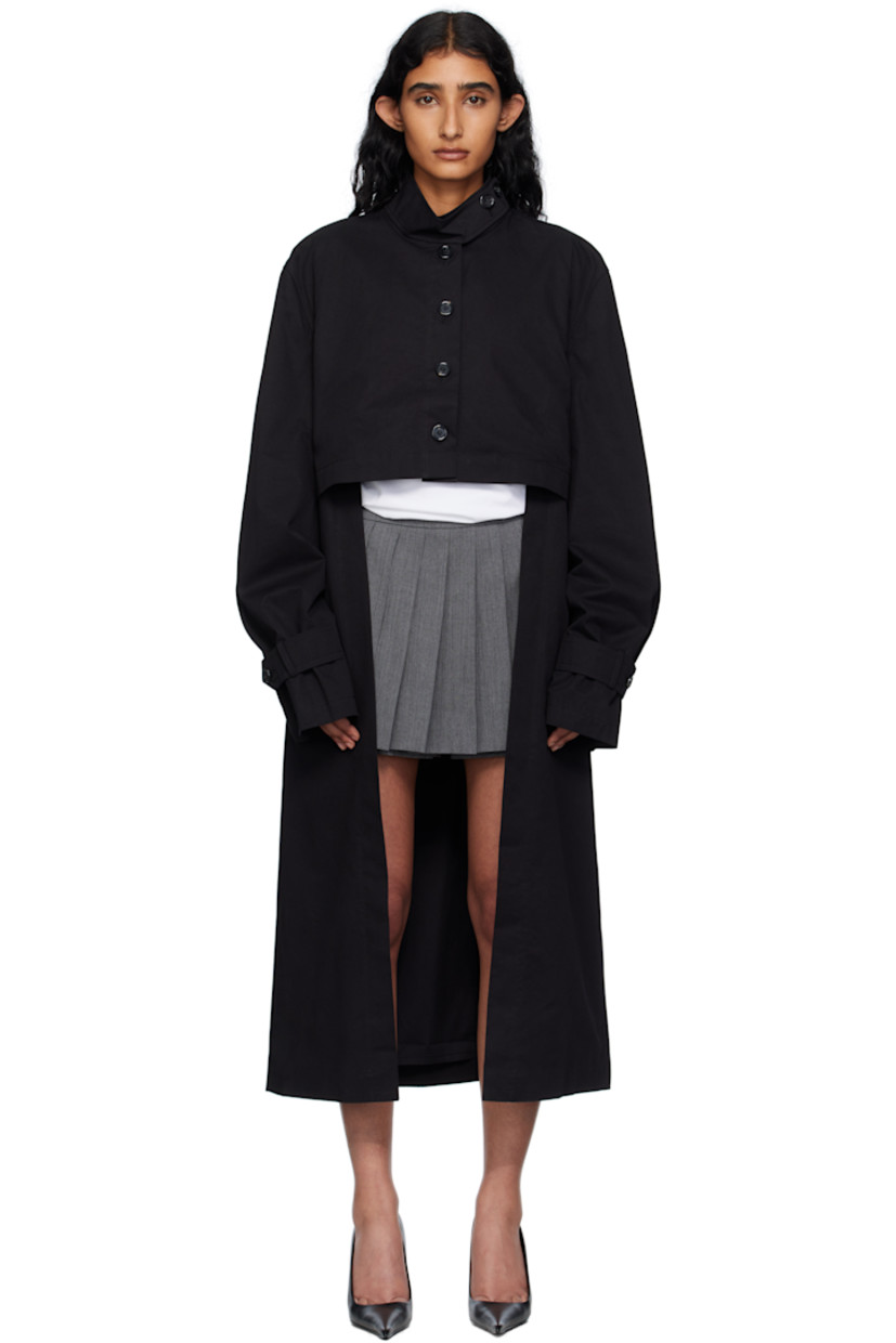 Cotton gabardine coat.

· Button tab at stand collar
· Button closure
· Flap pockets at front
· Seam pockets
· Button tab at cuffs
· Central vent at back hem
· Full poplin lining

Supplier color: Black