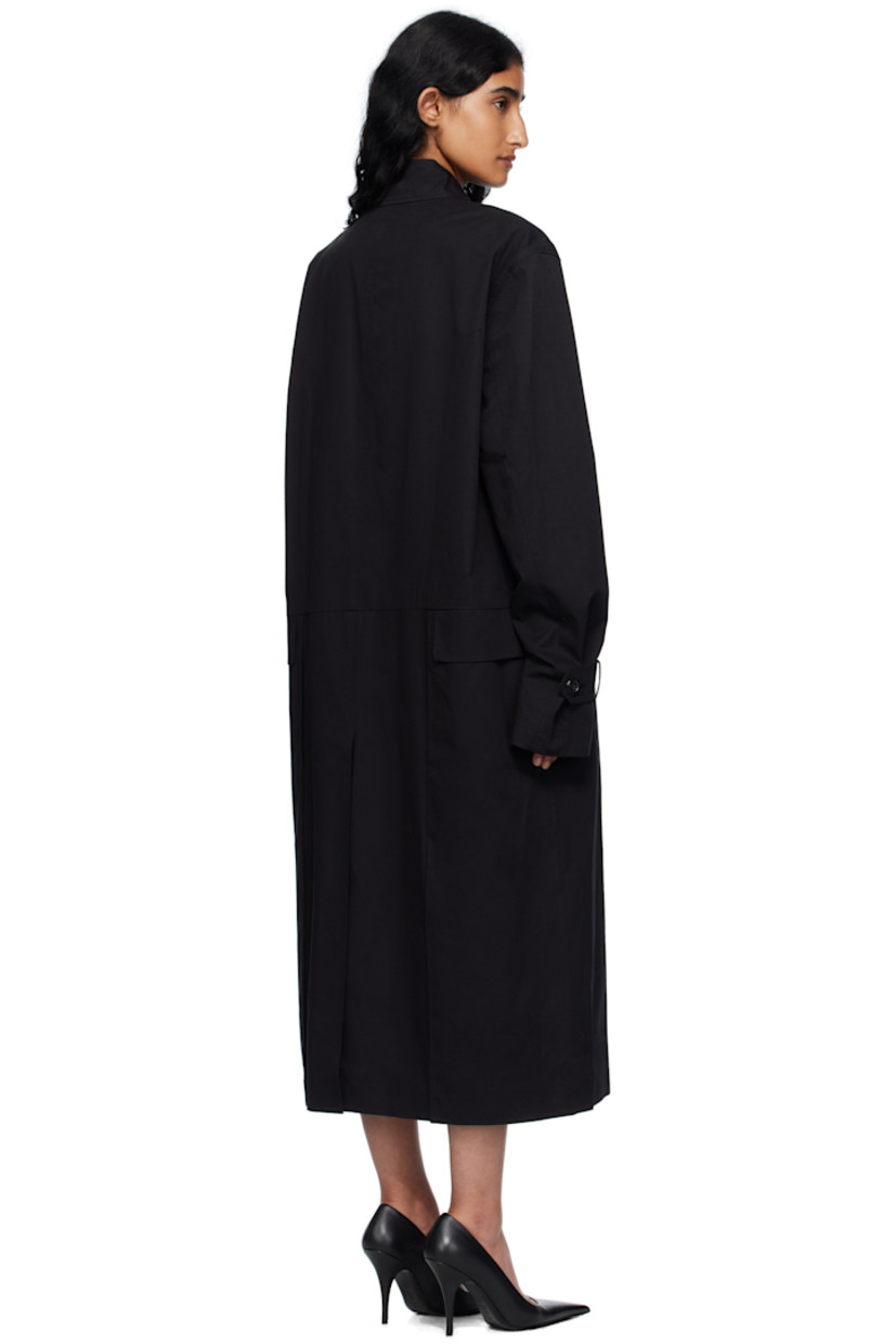 Cotton gabardine coat.

· Button tab at stand collar
· Button closure
· Flap pockets at front
· Seam pockets
· Button tab at cuffs
· Central vent at back hem
· Full poplin lining

Supplier color: Black