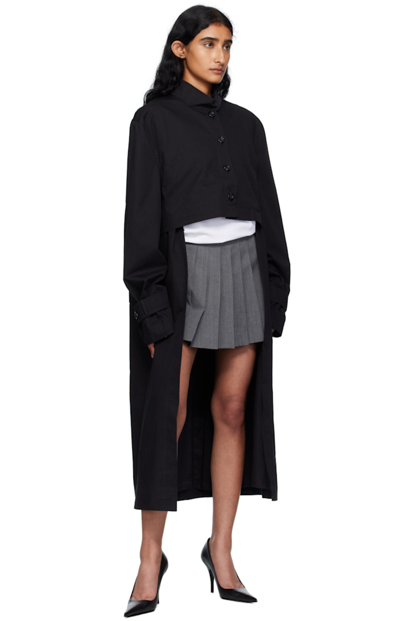 Cotton gabardine coat.

· Button tab at stand collar
· Button closure
· Flap pockets at front
· Seam pockets
· Button tab at cuffs
· Central vent at back hem
· Full poplin lining

Supplier color: Black