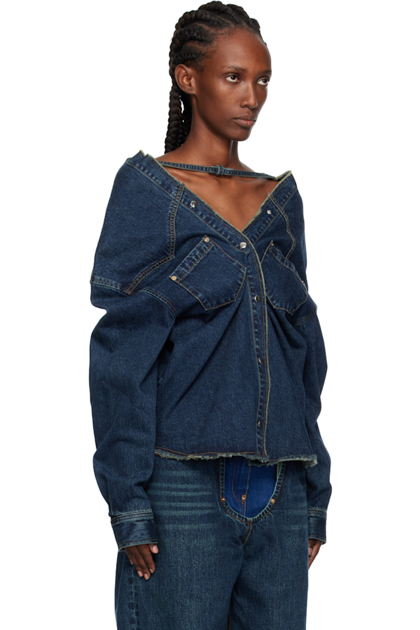 Non-stretch denim top.

· Fading throughout
· Strap with bow at boatneck
· Frayed edge at collar and hem
· Press-stud closure
· Patch pockets at chest
· Press-stud barrel cuffs
· Contrast stitching in tan

Supplier color: Dbl