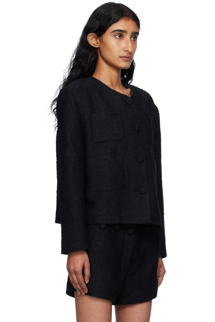 Bouclé tweed jacket.

· Round neck
· Button closure
· Patch pockets at front
· Padded shoulders
· Full satin lining

Supplier color: Bk