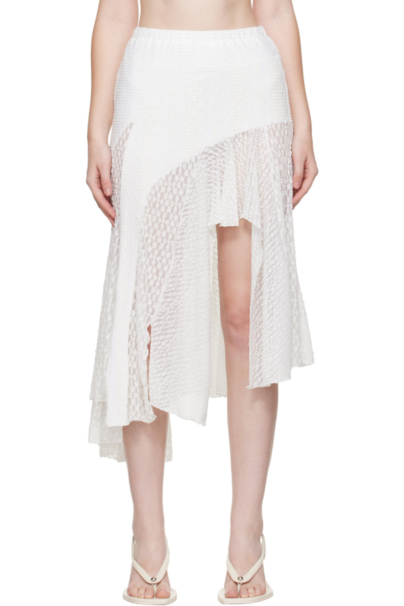Semi-sheer stretch nylon cloqué and lace midi skirt. 

· Embroidered pattern throughout
· Paneled construction 
· Scalloped edge and satin bow at elasticized waistband
· Vents at asymmetric hem 

Supplier color: White
