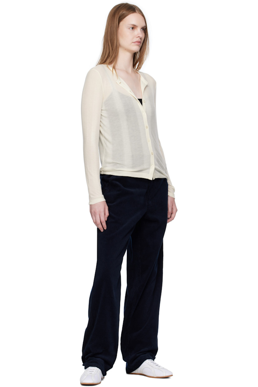 Lightweight rib-knit lyocell cardigan.

· Semi-sheer stripes throughout
· Round neck
· Button closure

Supplier color: Ecru