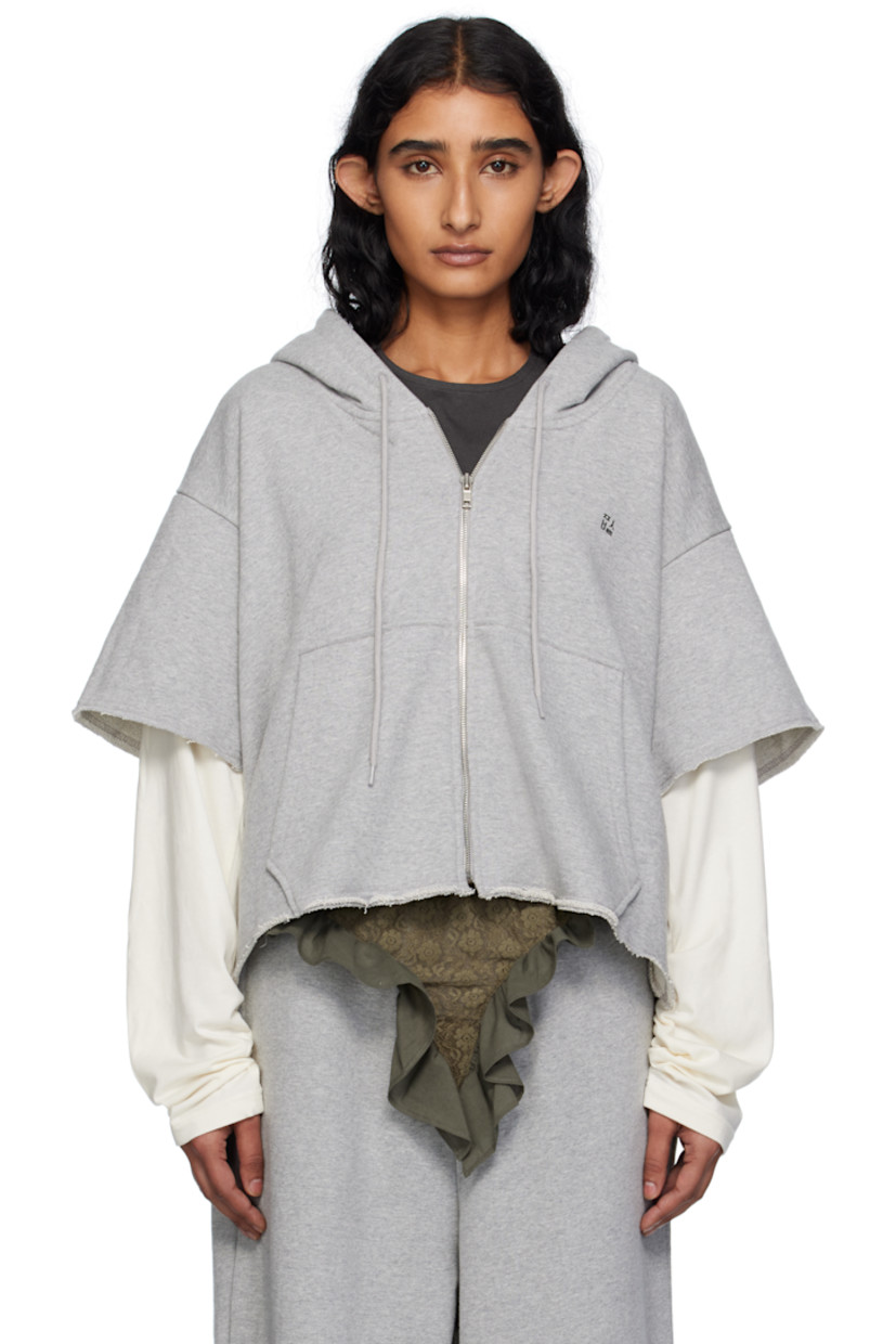 French terry hoodie.

· Drawstring at hood
· Zip closure
· Text printed at chest
· Patch pockets at front
· Raw edge at hem and layered sleeves
· Dropped shoulders
· Text printed at back

Supplier color: Grey