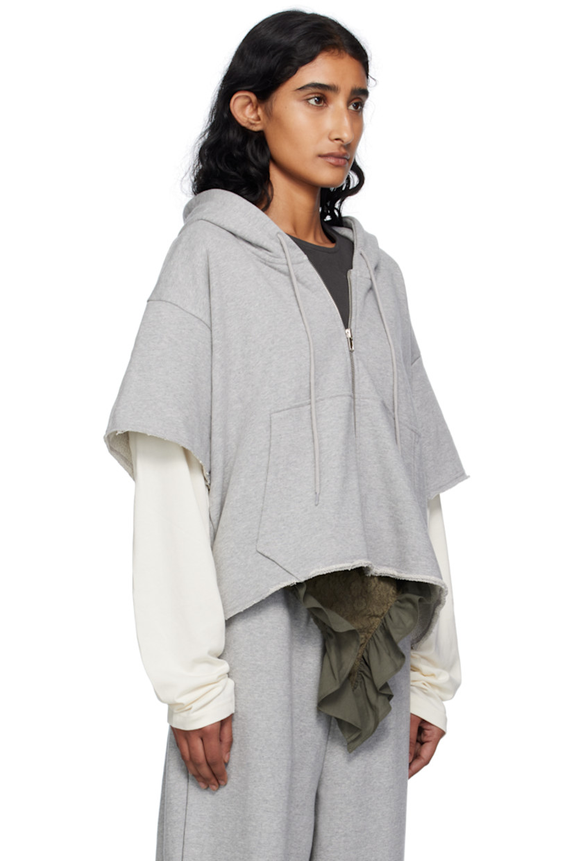 French terry hoodie.

· Drawstring at hood
· Zip closure
· Text printed at chest
· Patch pockets at front
· Raw edge at hem and layered sleeves
· Dropped shoulders
· Text printed at back

Supplier color: Grey