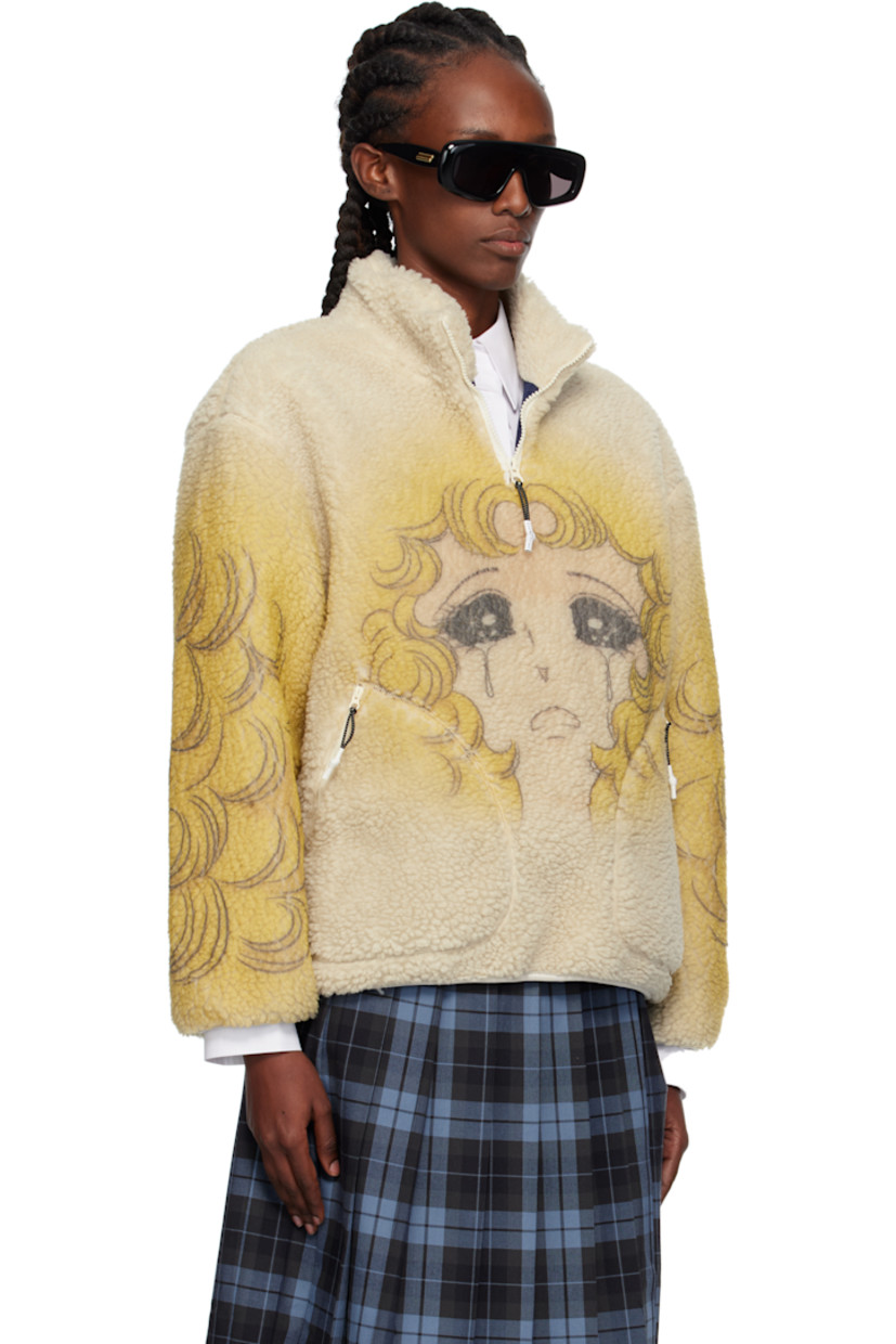 Sherpa fleece sweater.

· Stand collar
· Half-zip closure
· Graphic printed at front, sleeves, and back
· Zip pockets at front
· Elasticized hem and cuffs
· Full mesh lining

Supplier color: Lbg