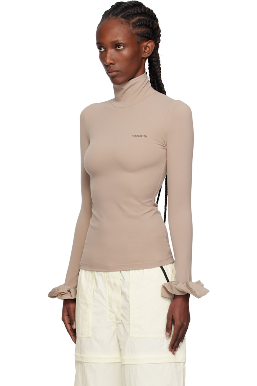 Stretch nylon jersey turtleneck.

· Logo printed at chest
· Ruffled trim at elasticized cuffs
· Zip closure at back

Supplier color: Bg