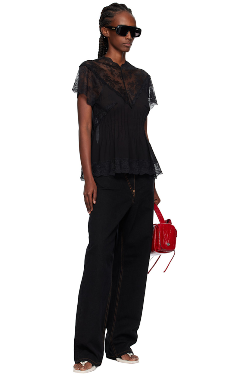 Semi-sheer modal-blend lace and chiffon top.

· Darts throughout
· Scalloped edge at V-neck, hem, and cuffs
· Button and zip closure at back

Supplier color: Bk