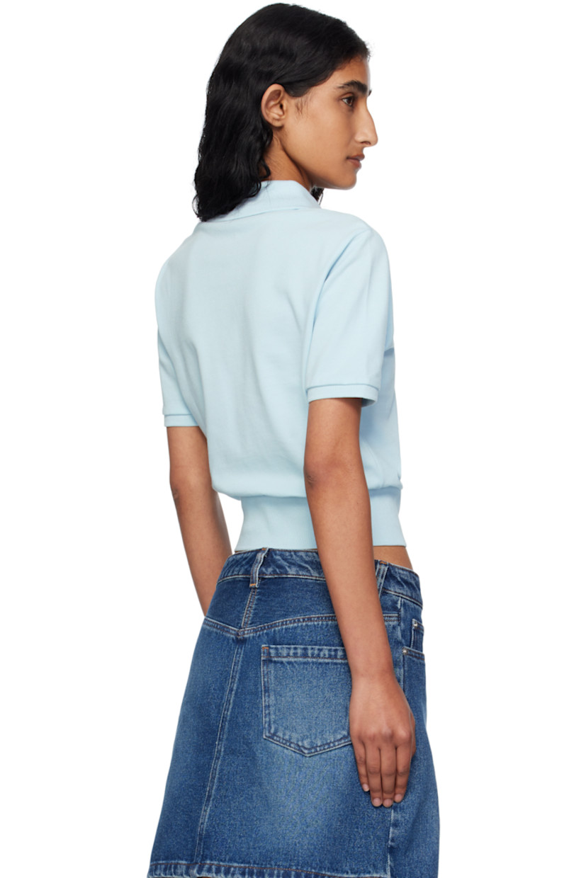 GOTS-certified organic cotton piqué polo.

· Rib-knit spread collar, hem, and cuffs
· Two-button placket
· Logo embroidered at chest
· Mother-of-pearl hardware

Supplier color: Light blue