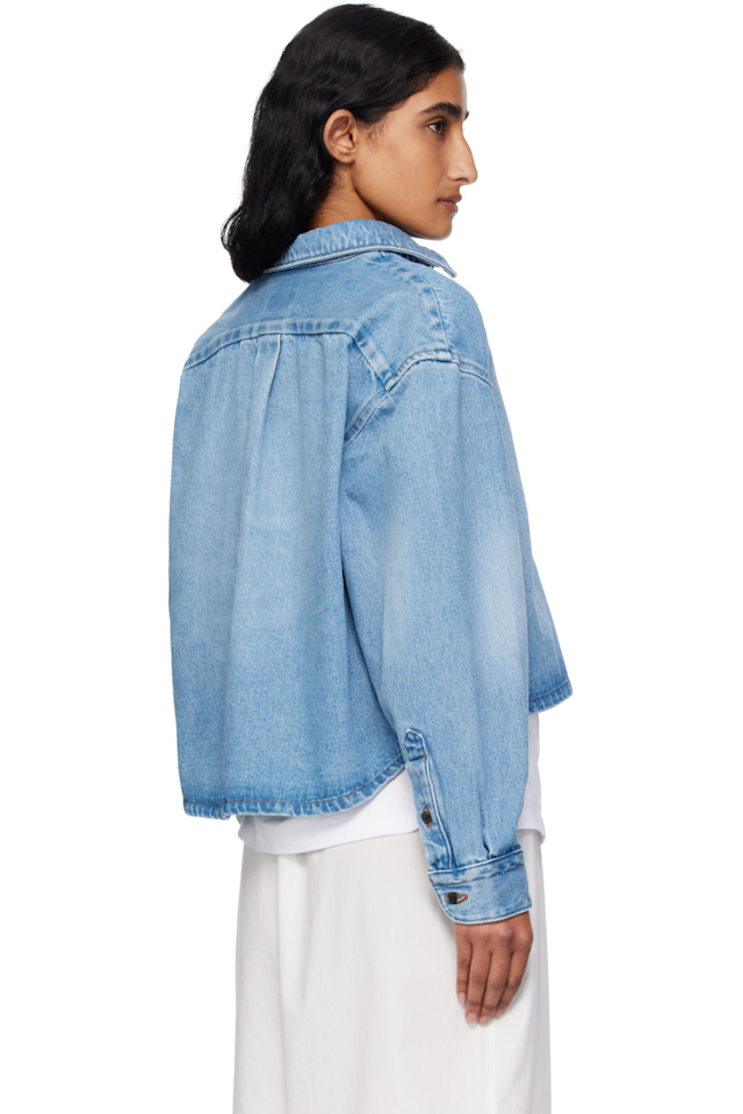 Non-stretch denim shirt.

· Fading throughout
· Spread collar
· Button closure
· Cropped hem
· Buttoned barrel cuffs
· Box pleat at back yoke
· Contrast stitching in tan

Supplier color: Light blue