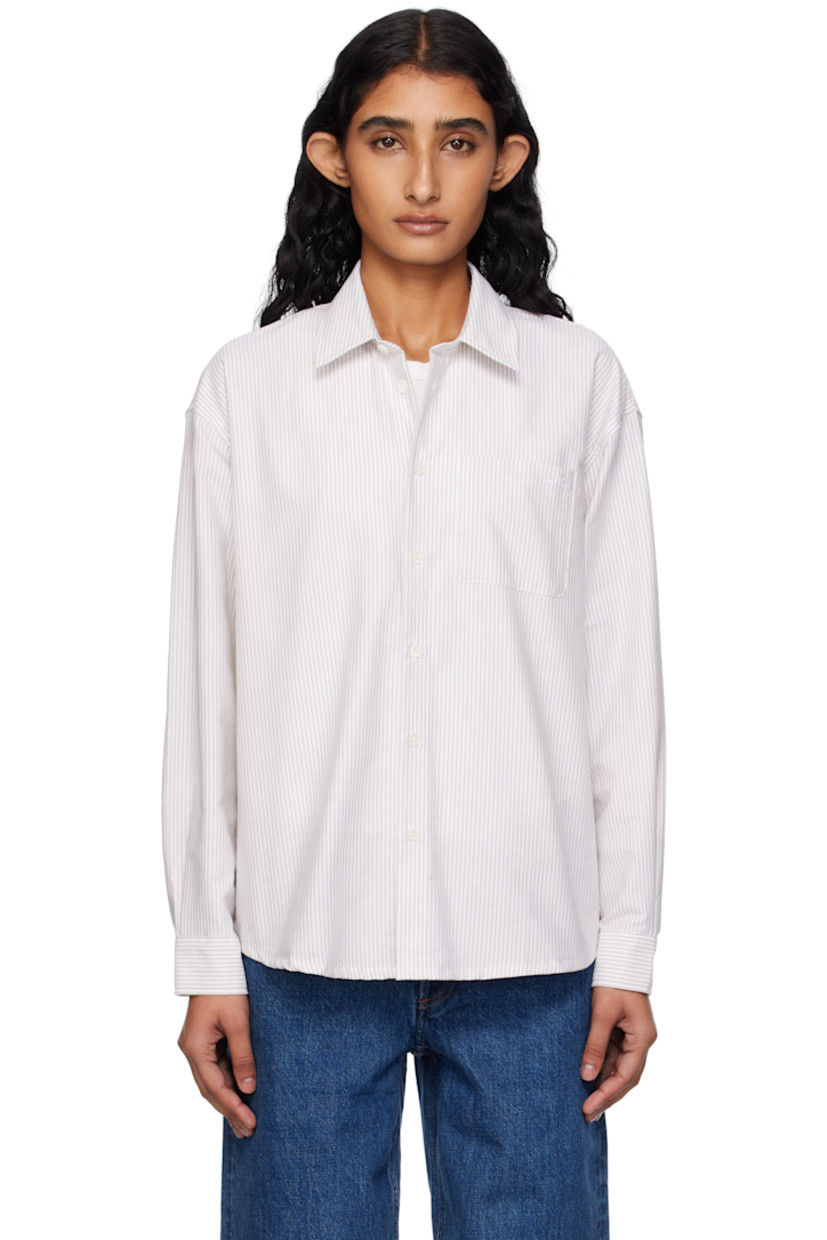 Organic cotton oxford cloth shirt.

· Stripes throughout
· Spread collar
· Button closure
· Logo-embroidered patch pocket at chest
· Shirttail hem
· Buttoned barrel cuffs
· Box pleat at back yoke
· Mother-of-pearl hardware

Supplier color: Beige