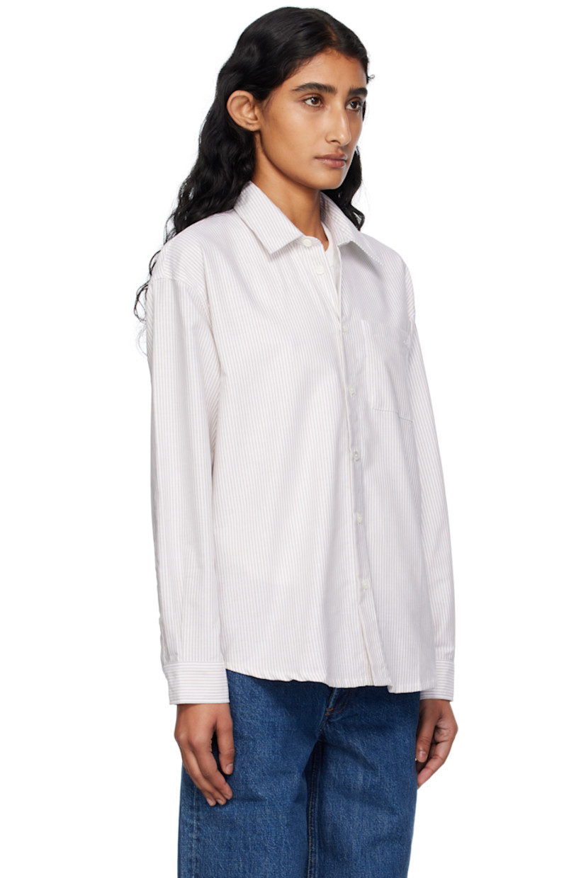 Organic cotton oxford cloth shirt.

· Stripes throughout
· Spread collar
· Button closure
· Logo-embroidered patch pocket at chest
· Shirttail hem
· Buttoned barrel cuffs
· Box pleat at back yoke
· Mother-of-pearl hardware

Supplier color: Beige