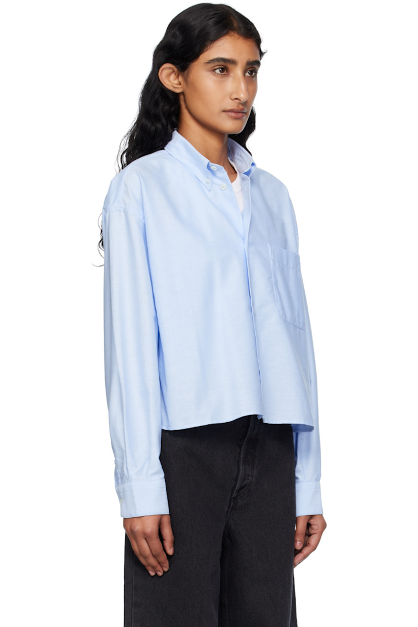 Organic cotton oxford cloth shirt.

· Spread collar
· Button closure
· Logo-embroidered patch pocket at chest
· Dropped shoulders
· Buttoned barrel cuffs
· Box pleat at back yoke

Supplier color: Light blue