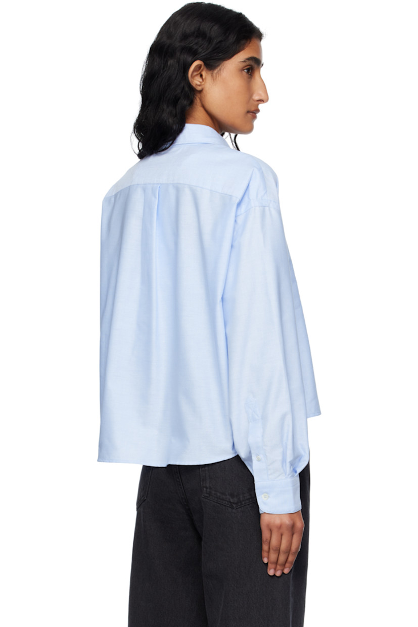 Organic cotton oxford cloth shirt.

· Spread collar
· Button closure
· Logo-embroidered patch pocket at chest
· Dropped shoulders
· Buttoned barrel cuffs
· Box pleat at back yoke

Supplier color: Light blue
