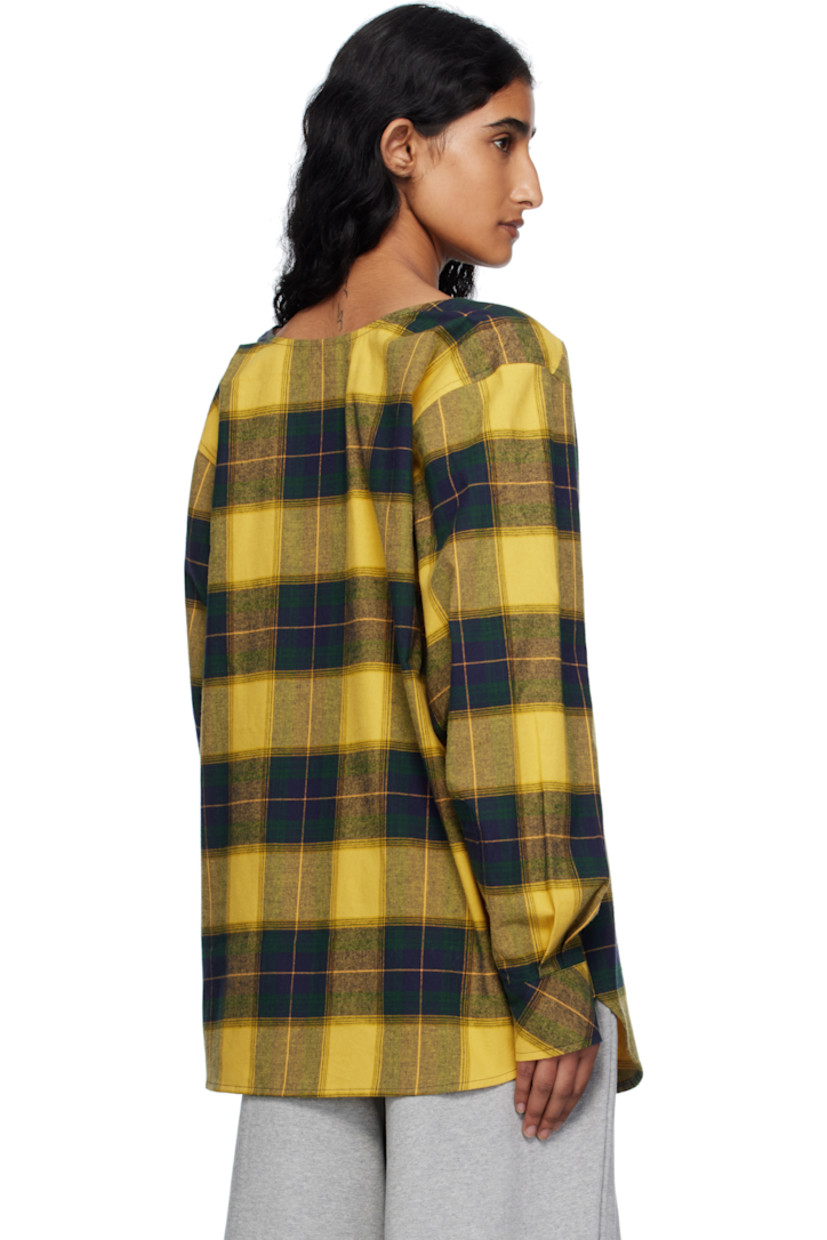Cotton flannel shirt.

· Check pattern throughout
· Square neck
· Spread collar for alternate styling
· Button closure
· Embroidered text and patch pocket at chest
· Shirttail hem
· Dropped shoulders
· Buttoned barrel cuffs

Supplier color: Gn/Ch