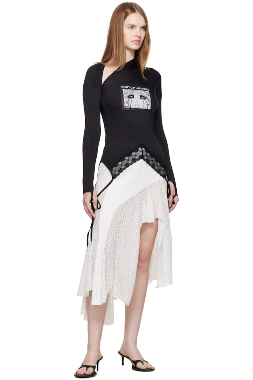 Stretch jersey and lace T-shirt. 

· Paneled construction 
· Draped asymmetric neck 
· Text and graphic printed at front 
· Self-tie straps at handkerchief hem

Supplier color: Black
