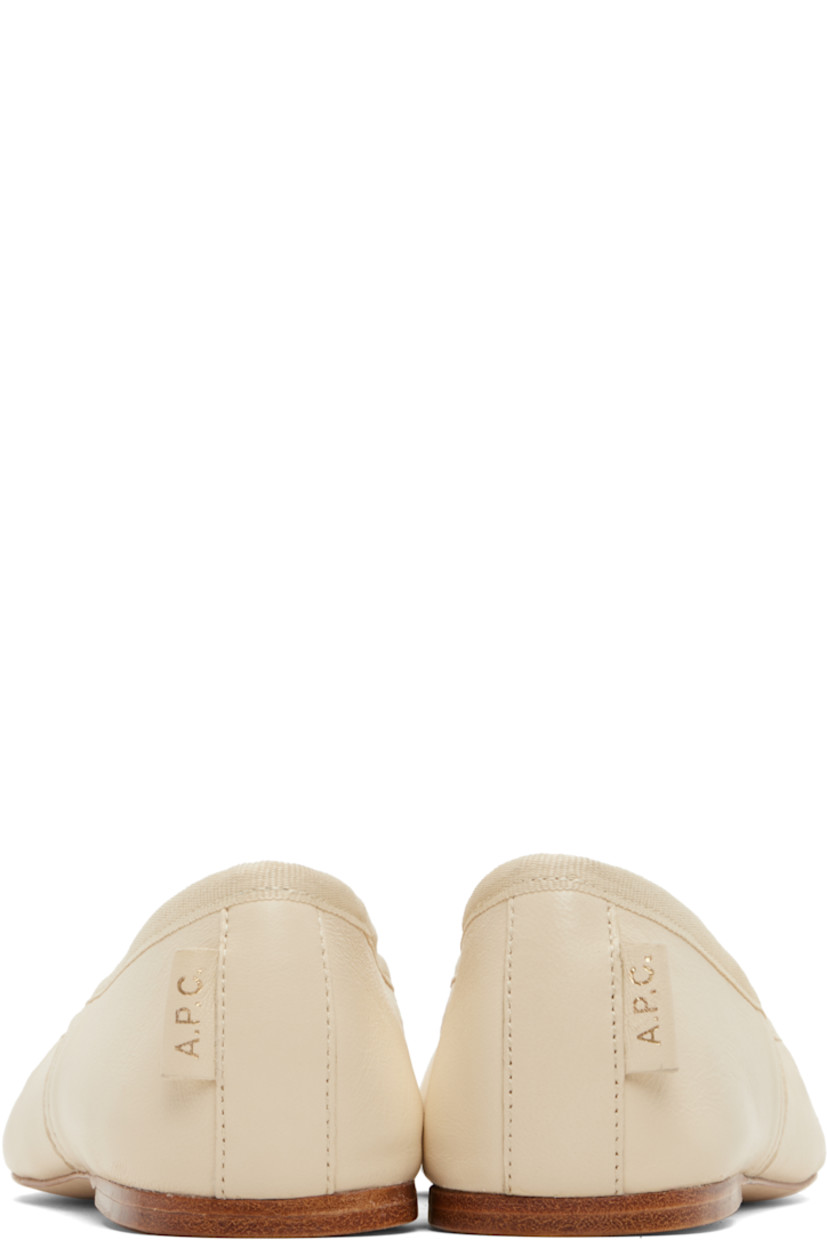 Buffed sheepskin ballerina flats.

· Elasticized strap at vamp
· Grosgrain trim at collar
· Topstitching at sides
· Leather logo flag at heel counter
· Twill lining
· Leather sole

Supplier color: Beige