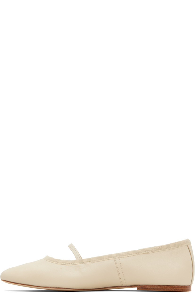 Buffed sheepskin ballerina flats.

· Elasticized strap at vamp
· Grosgrain trim at collar
· Topstitching at sides
· Leather logo flag at heel counter
· Twill lining
· Leather sole

Supplier color: Beige