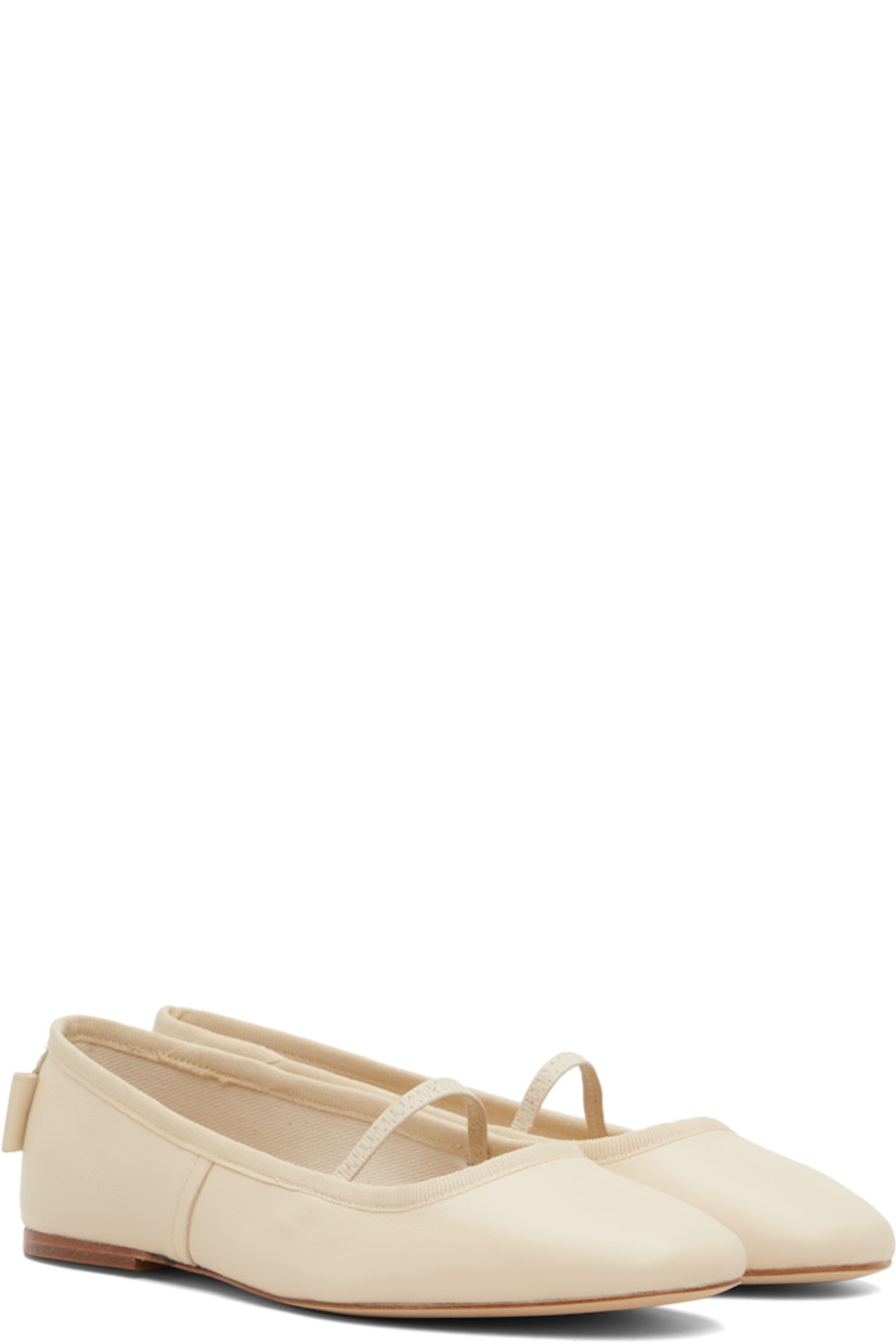 Buffed sheepskin ballerina flats.

· Elasticized strap at vamp
· Grosgrain trim at collar
· Topstitching at sides
· Leather logo flag at heel counter
· Twill lining
· Leather sole

Supplier color: Beige