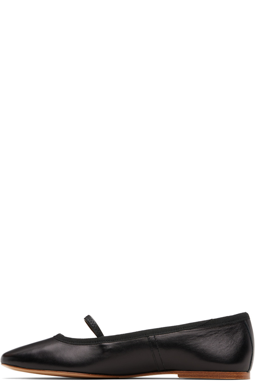 Buffed sheepskin ballerina flats.

· Elasticized strap at vamp
· Grosgrain trim at collar
· Topstitching at sides
· Leather logo flag at heel counter
· Twill lining
· Leather sole

Supplier color: Black