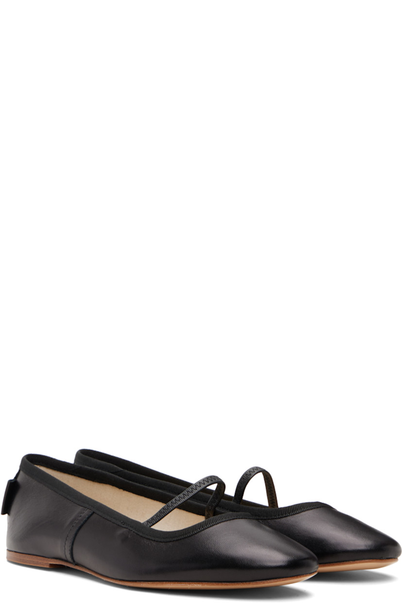 Buffed sheepskin ballerina flats.

· Elasticized strap at vamp
· Grosgrain trim at collar
· Topstitching at sides
· Leather logo flag at heel counter
· Twill lining
· Leather sole

Supplier color: Black