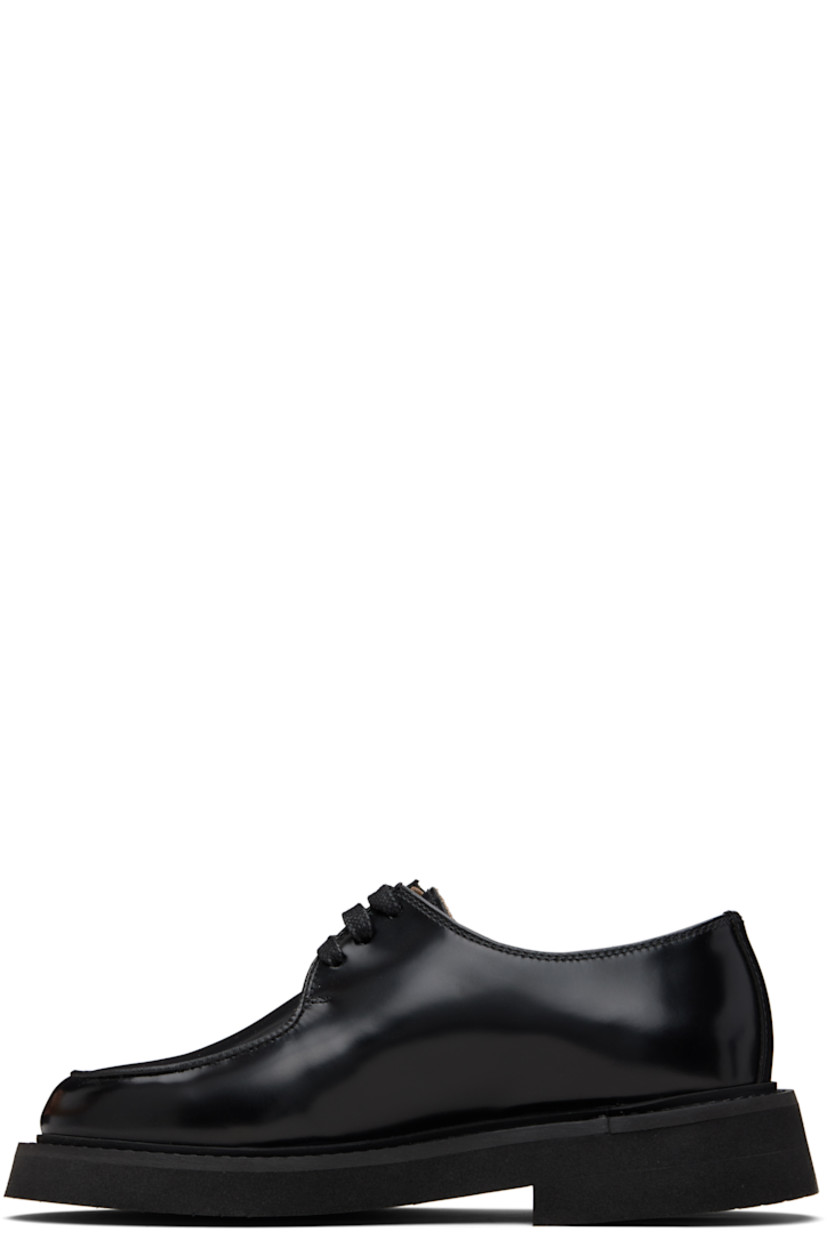 Polished leather oxfords.

· Moc toe
· Lace-up closure
· Topstitching at welt
· Foam rubber midsole
· Treaded rubber sole

Supplier color: Black