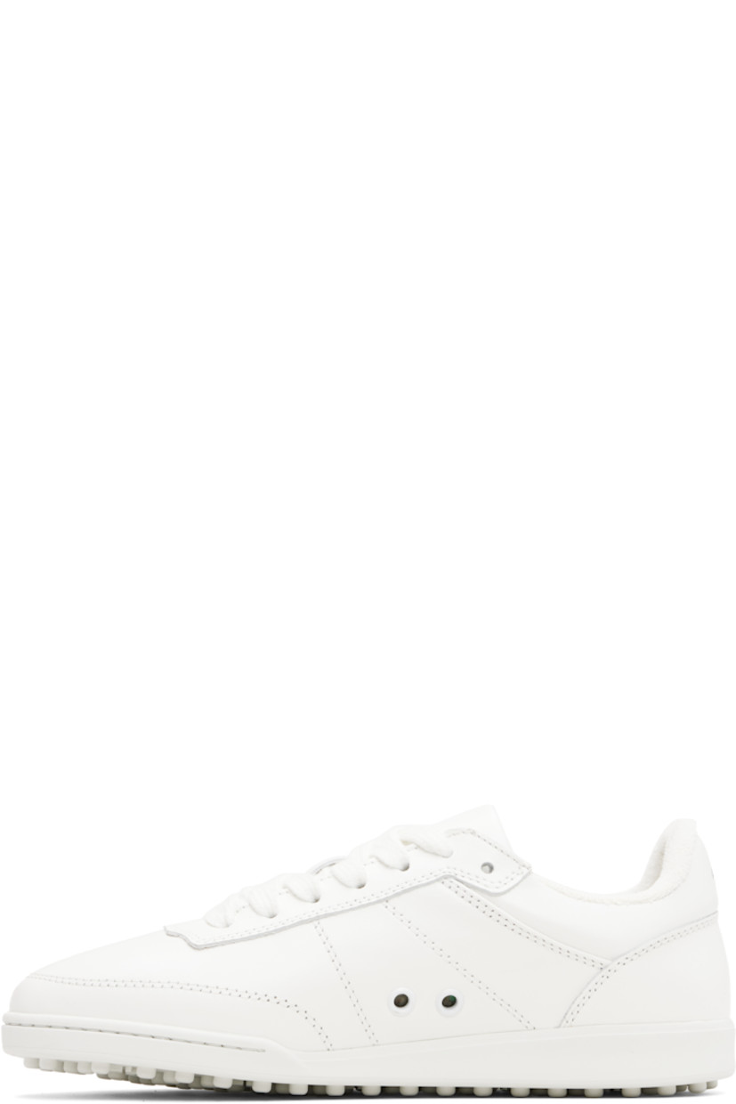 Low-top buffed leather sneakers.

· Topstitching throughout
· Lace-up closure
· Padded tongue and collar
· Logo stamp at heel tab
· Eyelets at inner side 
· Terrycloth lining
· Logo embossed at rubber midsole
· Treaded rubber sole

Supplier color: White