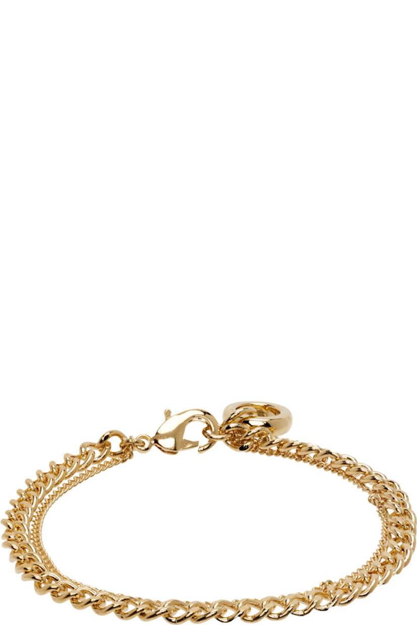 Tiered curb chain bracelet in gold-tone brass. Logo charm at lobster-clasp fastening.

Supplier color: Or