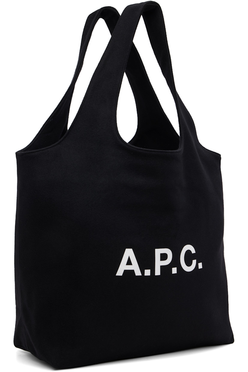 Felted tote.

· Integrated twin shoulder straps
· Logo printed at face
· Open throat
· Patch pocket at interior 
· Twill lining
· H13.5" x W19" x D6"

Supplier color: Black