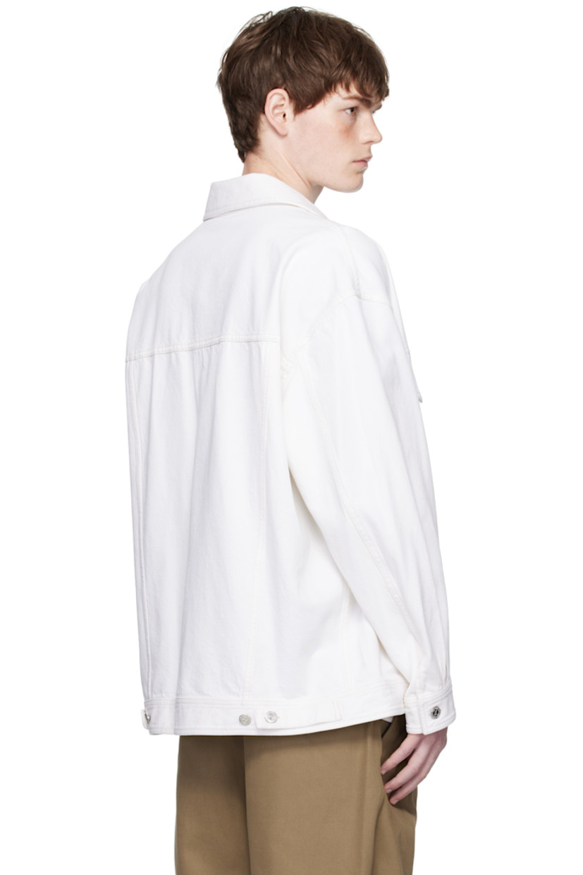 Non-stretch organic cotton denim jacket.

· Spread collar
· Button closure
· Flap and welt pockets at front
· Buttoned cuffs
· Adjustable button tabs at back hem

Supplier color: Off white