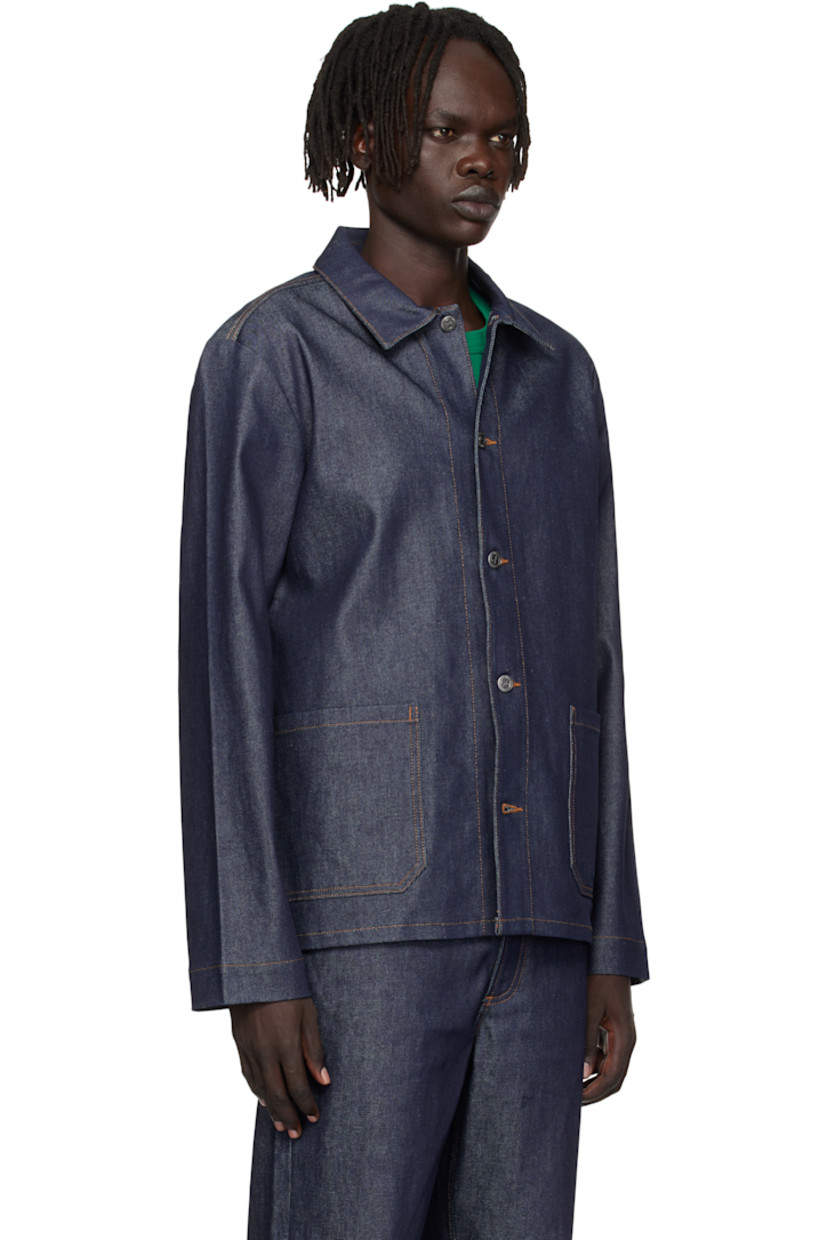 Stretch denim jacket. 

· Spread collar 
· Button closure
· Patch pockets at front 
· Logo embroidered at front hem 
· Logo-engraved silver-tone hardware 
· Contrast stitching in tan 

Supplier color: Indigo