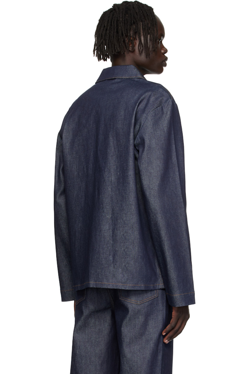 Stretch denim jacket. 

· Spread collar 
· Button closure
· Patch pockets at front 
· Logo embroidered at front hem 
· Logo-engraved silver-tone hardware 
· Contrast stitching in tan 

Supplier color: Indigo
