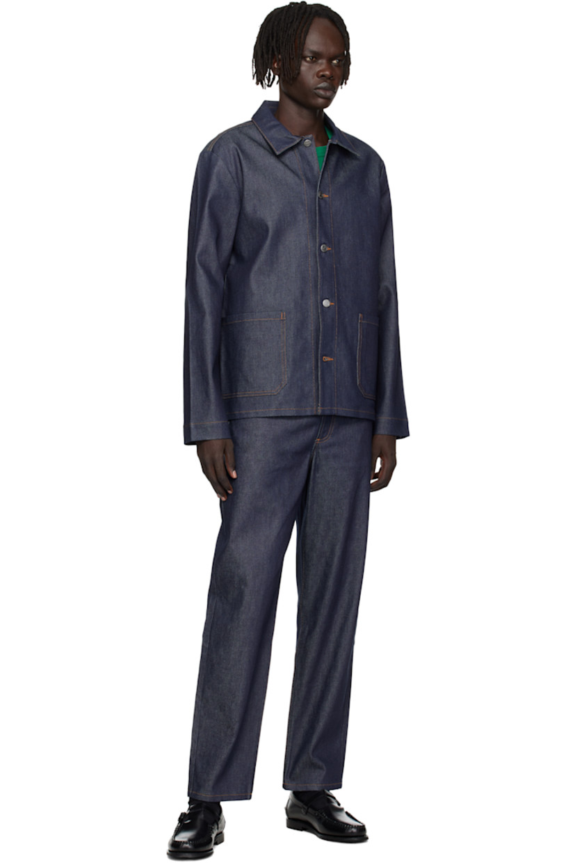 Stretch denim jacket. 

· Spread collar 
· Button closure
· Patch pockets at front 
· Logo embroidered at front hem 
· Logo-engraved silver-tone hardware 
· Contrast stitching in tan 

Supplier color: Indigo